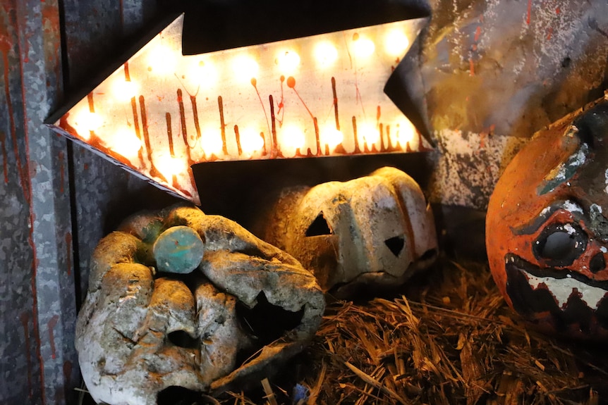 A close up of rotten pumpkins at a Halloween haunted house 