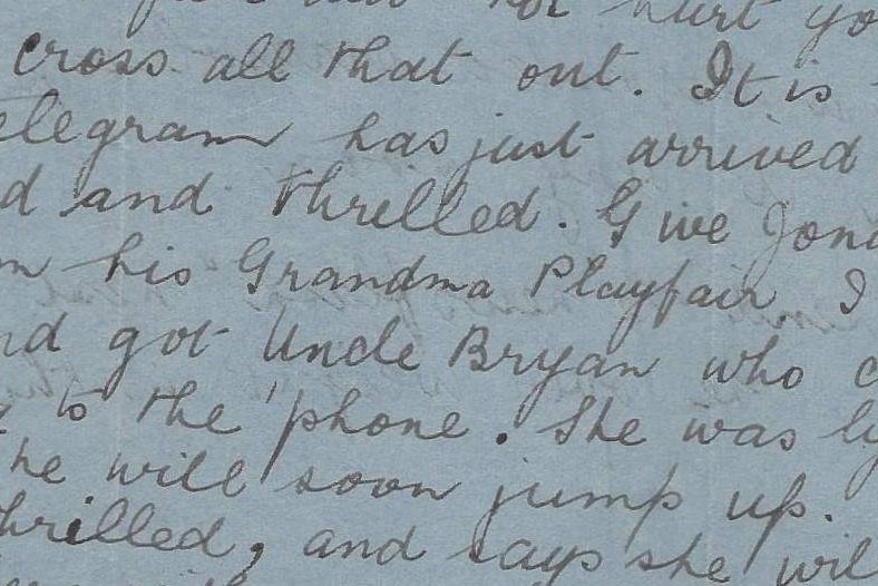 A scan of an old letter written in cursive details a grandmother's delight and the birth of her grandchild.