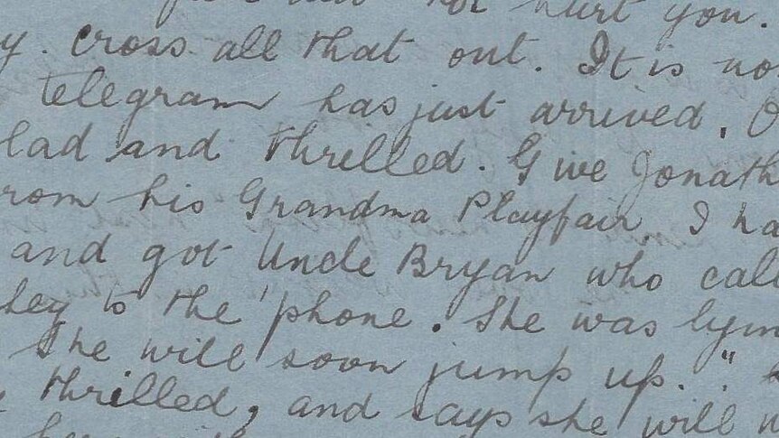 A scan of an old letter written in cursive details a grandmother's delight and the birth of her grandchild.