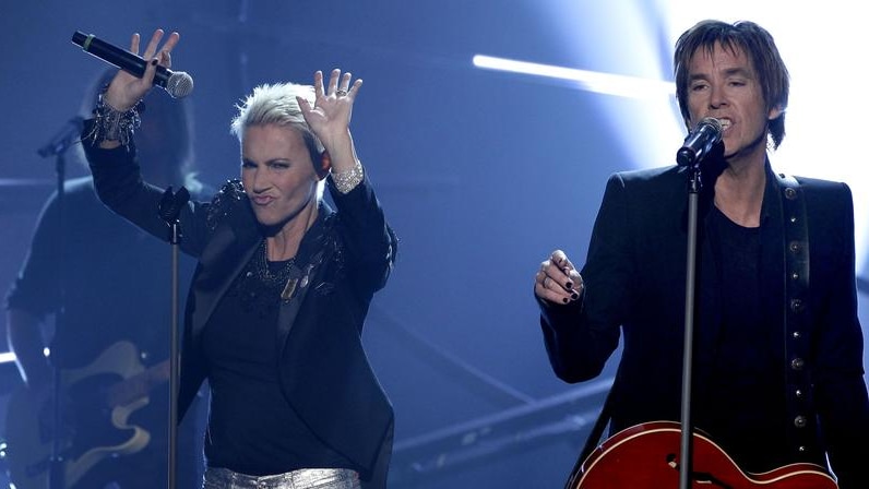 Marie Fredriksson and Per Gessle of Swedish pop duo Roxette performing on stage.