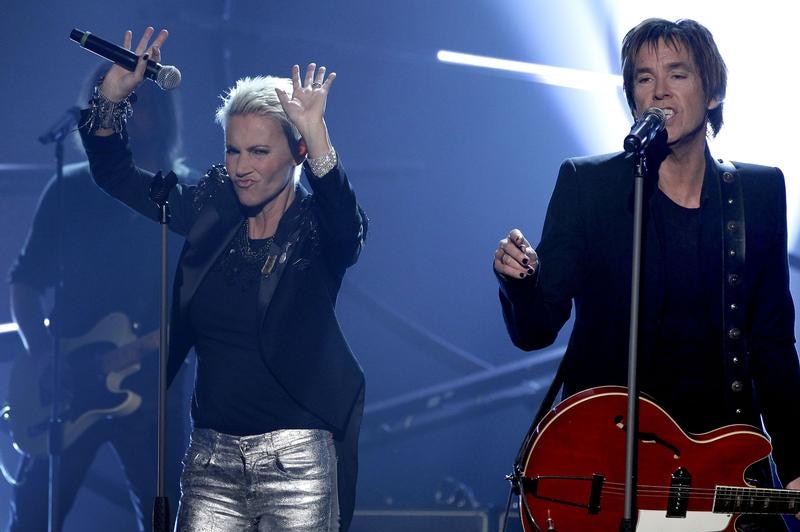 Marie Fredriksson and Per Gessle of Swedish pop duo Roxette performing on stage.
