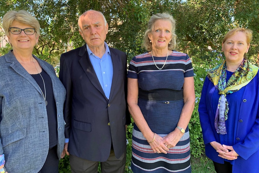 A group photo including Dr Alex Cockram (left), Professor Allan Fels, Penny Armytage, Professor Bernadette McSherry (right).