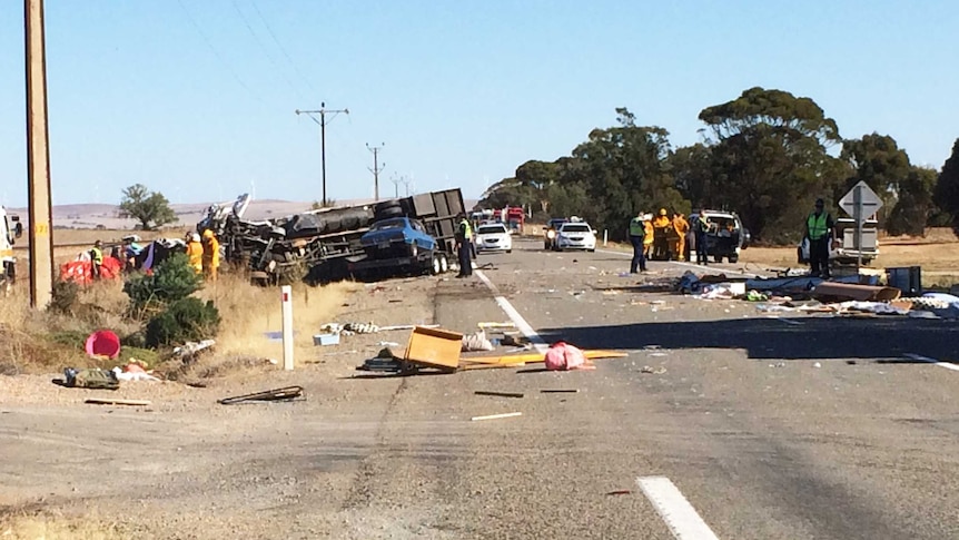 Debris litters Highway One after a serious crash
