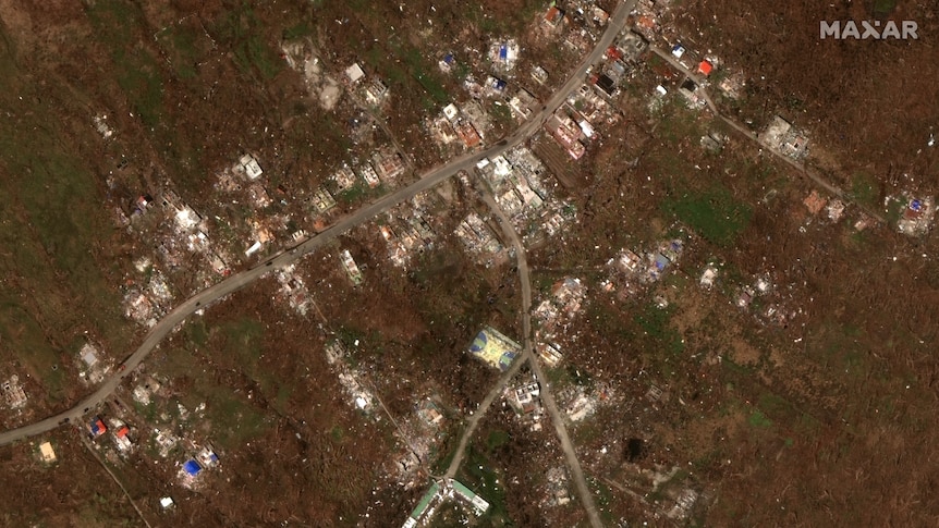 A satellite image of destroyed houses on an island after a hurricane
