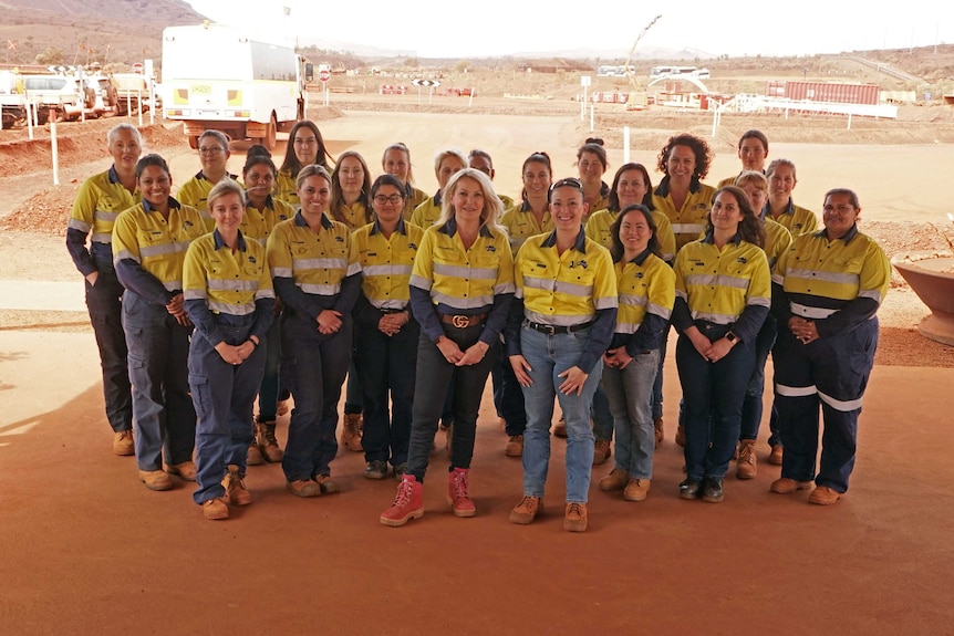 Fortescue CEO Elizabeth Gaines with a group of the company's workers at one of its sites.