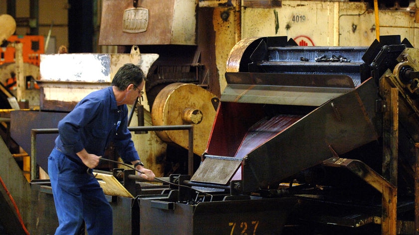 Car components worker at furnace