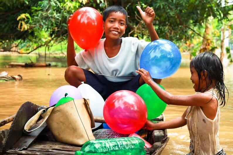 Cambodian kids play with balloons