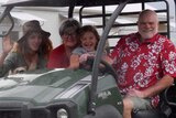 Cobargo foster family sit in a new buggy smiling one year after bushfires.
