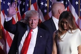 President-elect Donald Trump waves as he walks with his wife Melania Trump followed by his daughter Ivanka Trump.