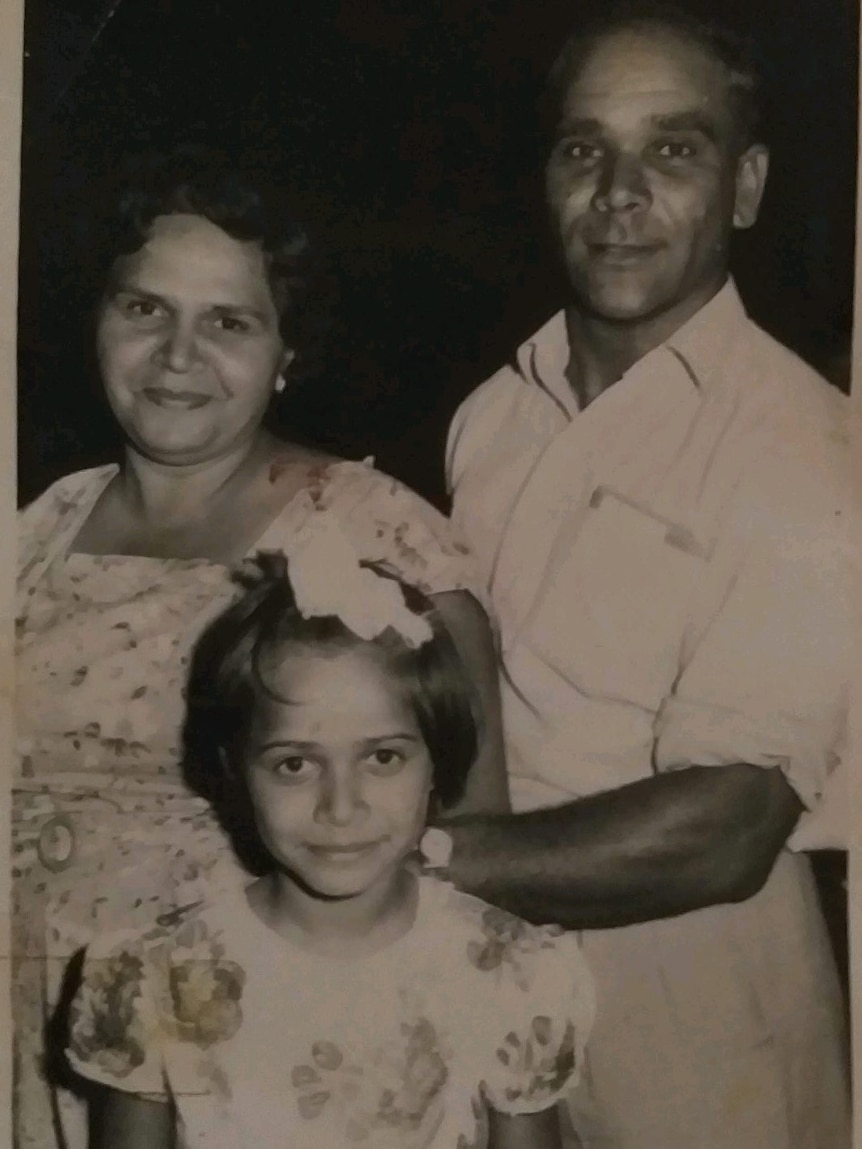 An old photo about an aboriginal family of three