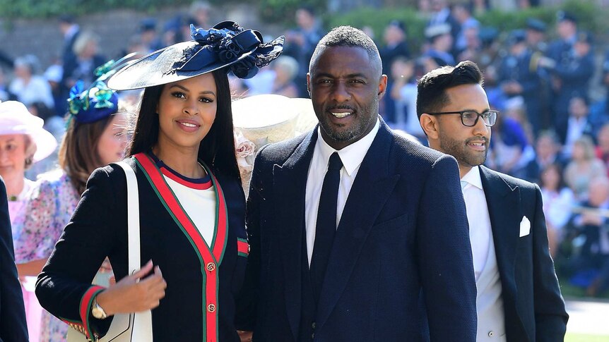 Idris Elba and Sabrina Dhowre arrive at St George's Chapel.