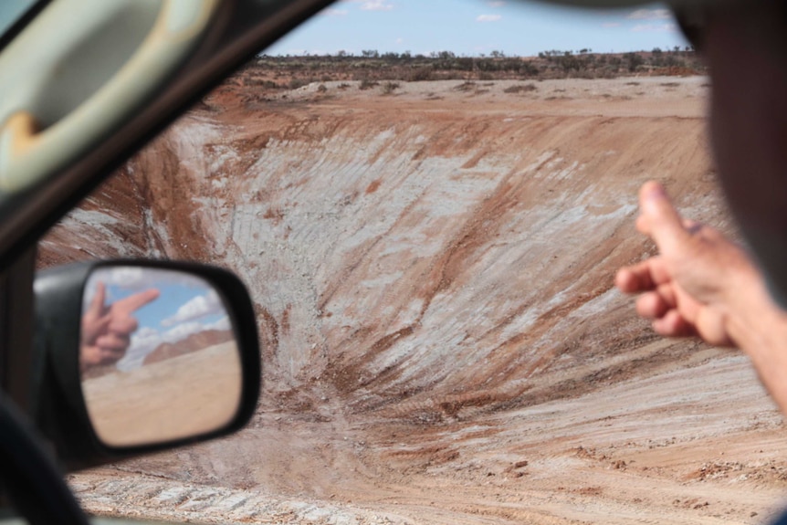 Grazier Richard Wilson points at an empty dam on his property