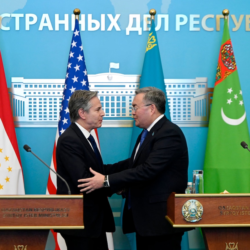 US Secretary of State Antony Blinken and Kazakhstan's Foreign Minister shake hands