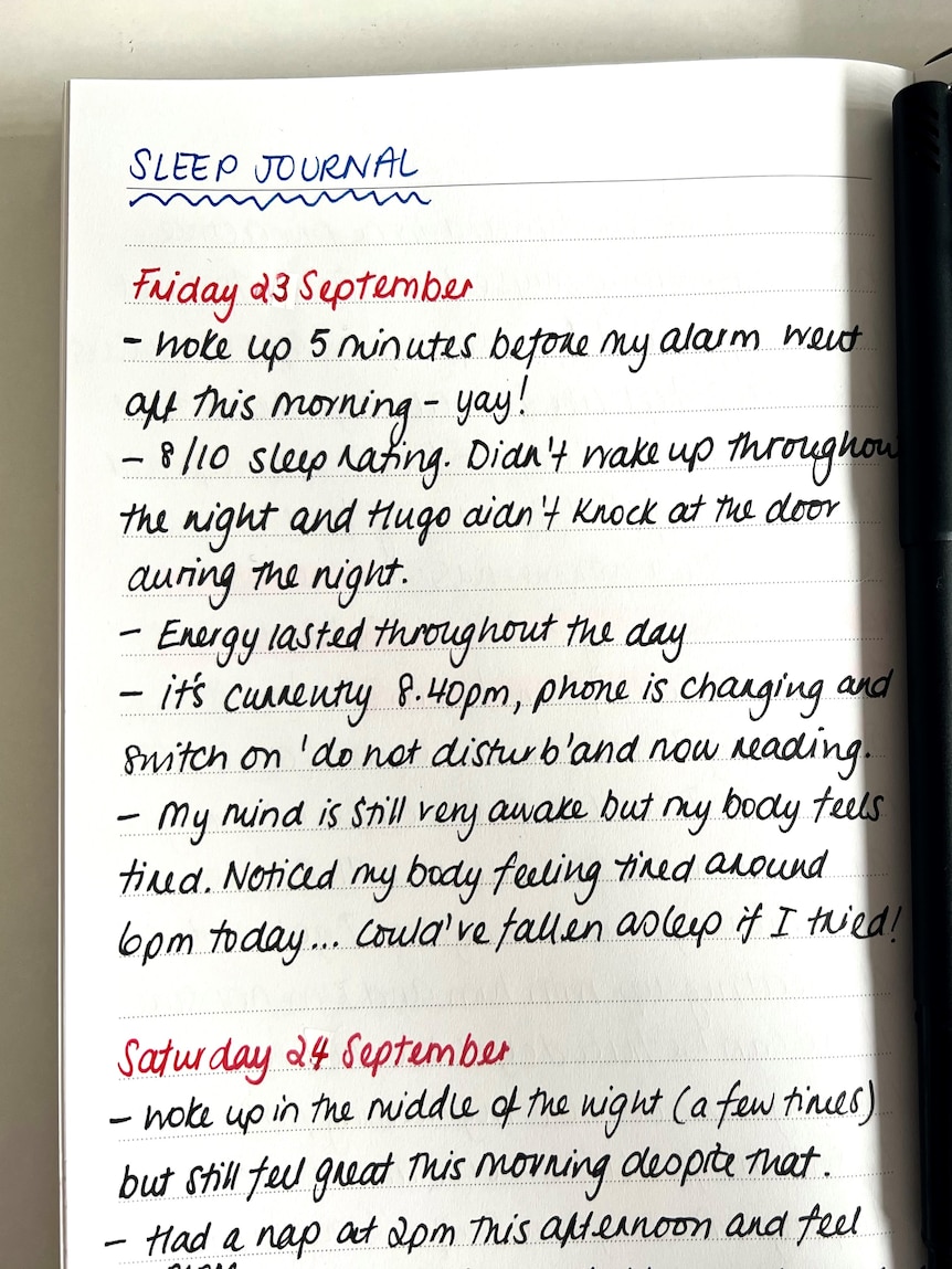 A photo of Tahnee Jash's sleep journal entry that is handwritten in a notebook on Friday 23 September in black, blue and red ink