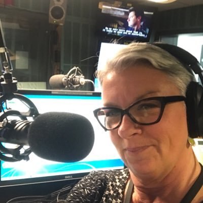 Former ABC PM presenter Linda Mottram infront of a microphone in the studio
