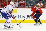 Nathan Walker skates with the puck against defenseman Victor Mete.