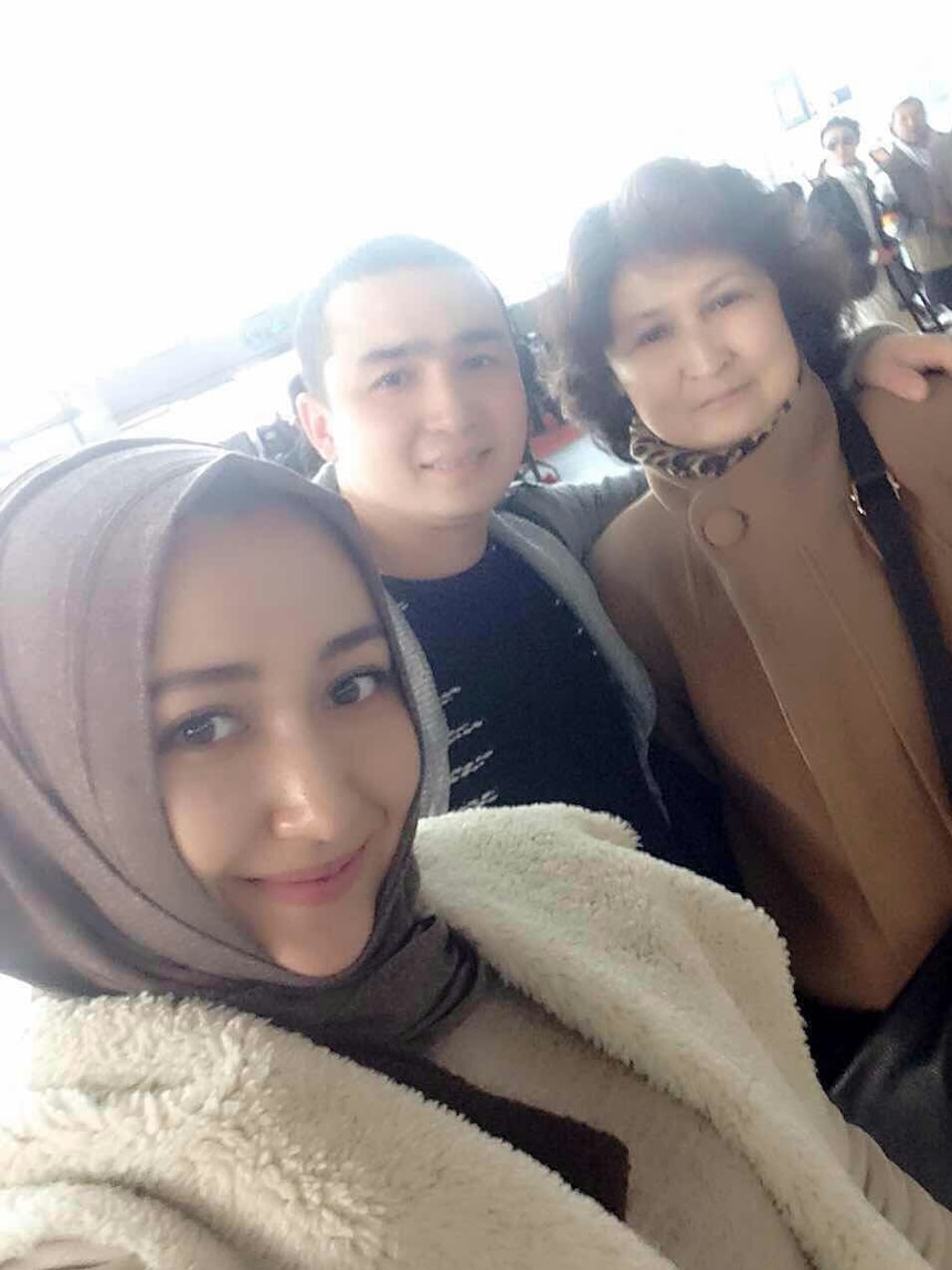 Mr Nizamidin with his wife and mother who are both now under detention.
