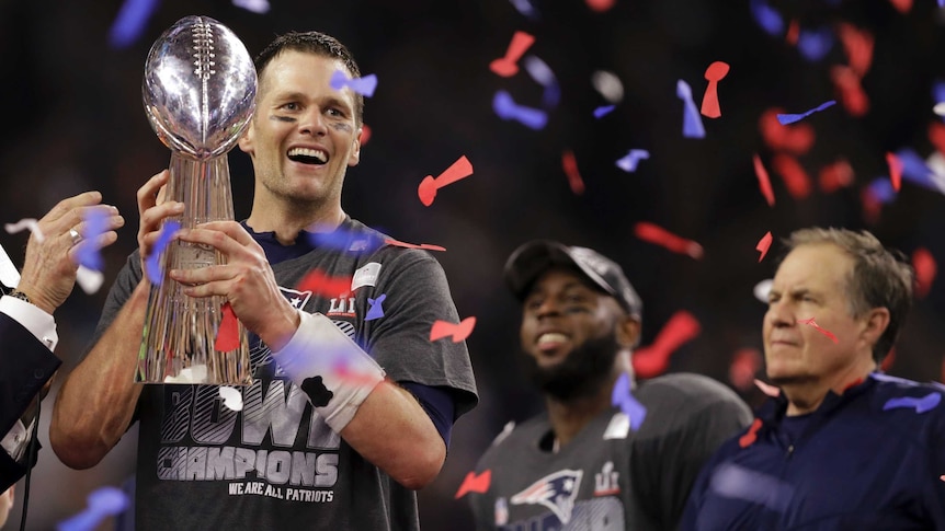 Tom Brady celebrates with the Super Bowl trophy