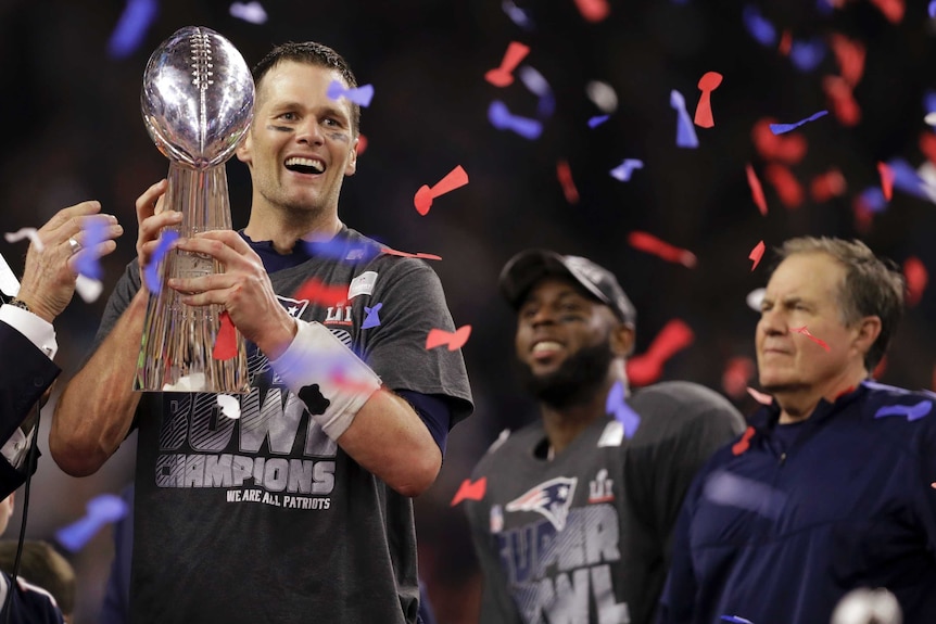 Tom Brady celebrates with the Super Bowl trophy