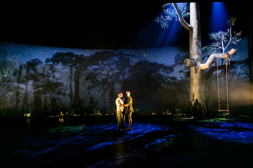 Colour photography of Ursula Yovich and Caleena Sansbury centrestage during theatre production Man with the Iron Neck.