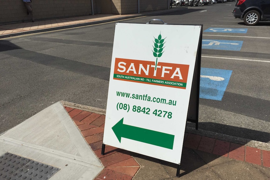 A sign points to the SA No Til Farmers Association conference