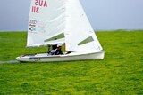 Australia's 470 men's crew, Nathan Wilmot and Malcolm Page, negotiate their way through algae on the Beijing Olympic Games sailing course at Qingdao.
