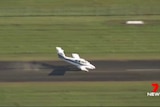 Light plane with nose grinding into runway after making emergency landing