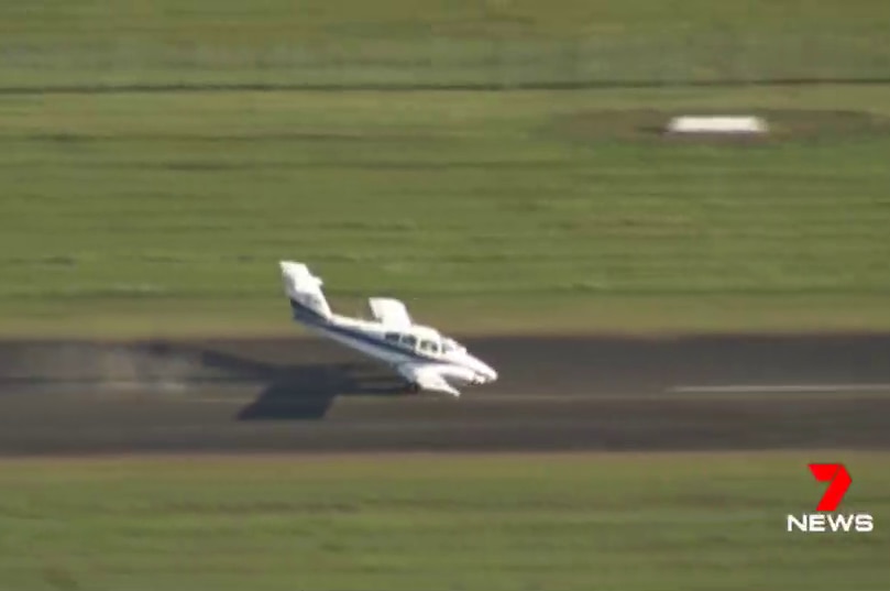 Light plane with nose grinding into runway after making emergency landing