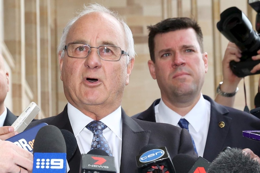 A tight head and shoulders shot of WA Liberal MPs Brian Ellis and Phillip Edman at a media conference outside WA Parliament.