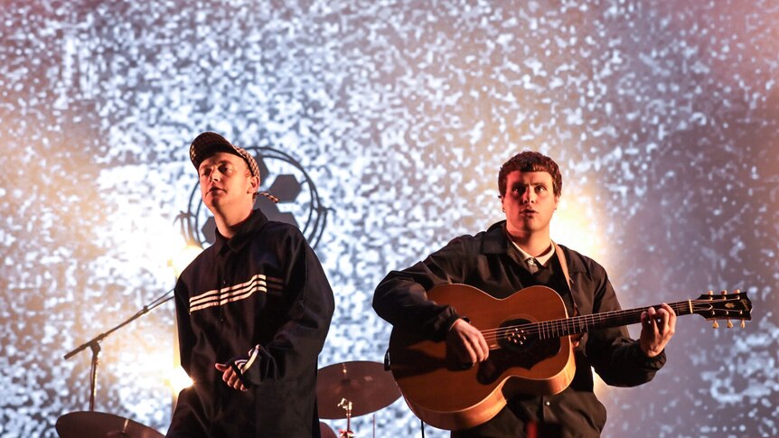 Tommy O'Dell and Johnny Took of DMA's stand on stage at Splendour In The Grass