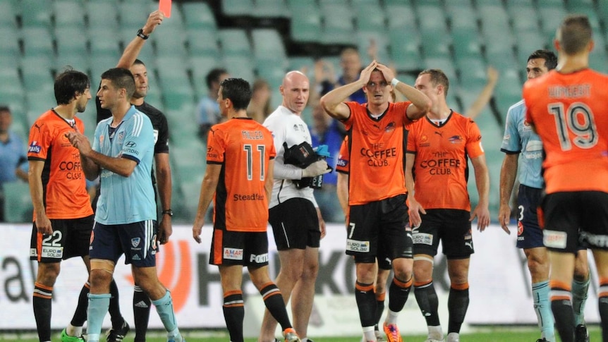 Brisbane Roar's Besart Berisha receives a red card from referee against Sydney FC in March 2014.