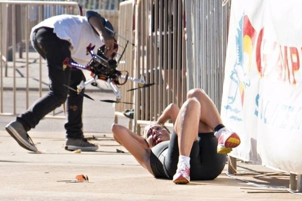 Raija Ogden lays on the ground after being hit by a drone.