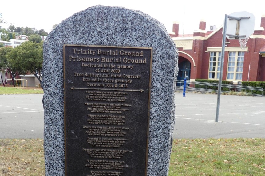 A stone plaque dedicated to the more than 500 settlers and bond convicts buried beneath Campbell Street Primary.