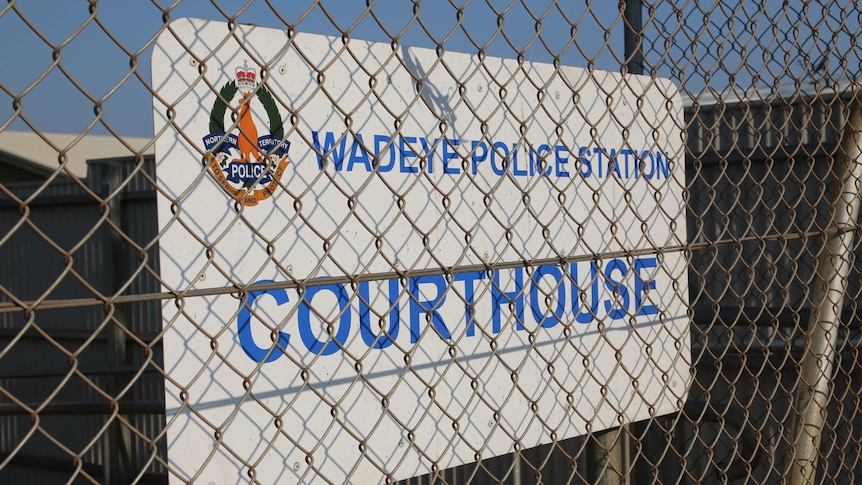 A sign at the entrance of the police station and makeshift courthouse