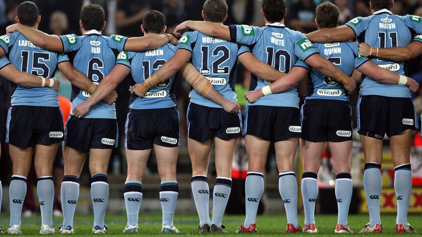 The Blues line up for the national anthem before match two of the ARL State of Origin in 2008.