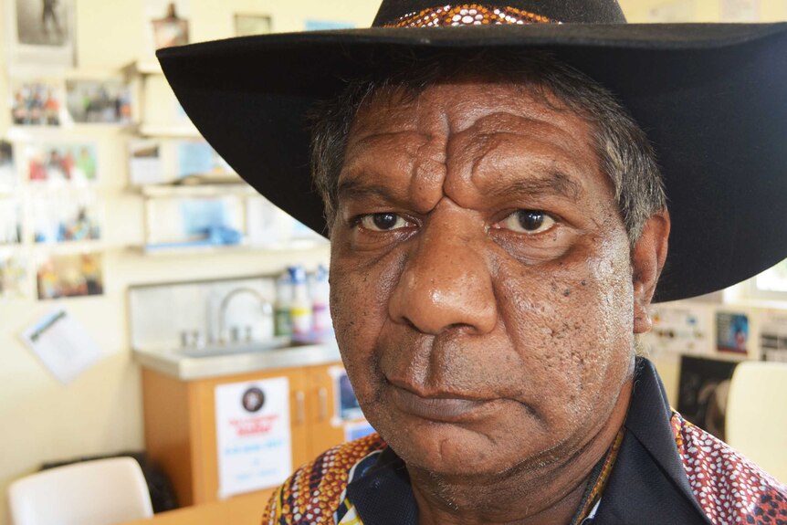 A close up shot of Indigenous elder Charlie Chambers wearing a black cowboy hat  at Southern Queensland Correctional Centre.