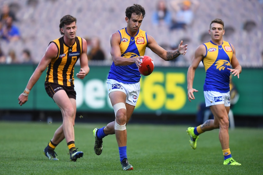 Brendon Ah Chee kicks the footy for West Coast