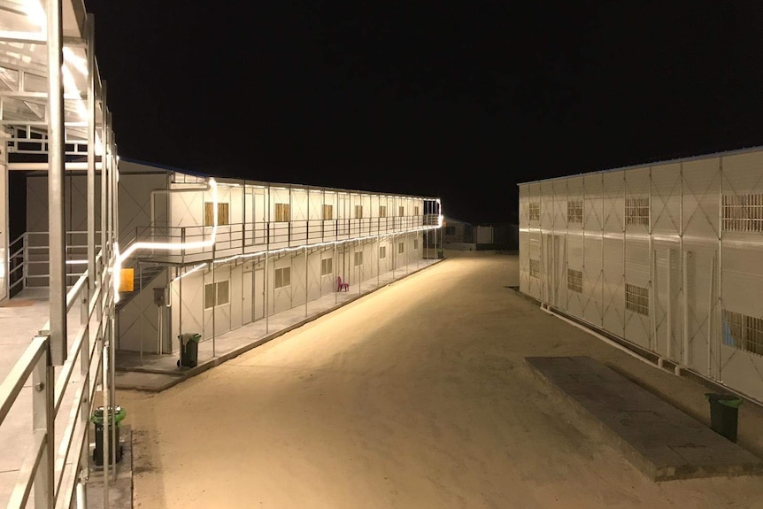 Two-storey prefab housing at nighttime.