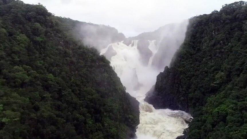 Water rushes over falls after heavy rain