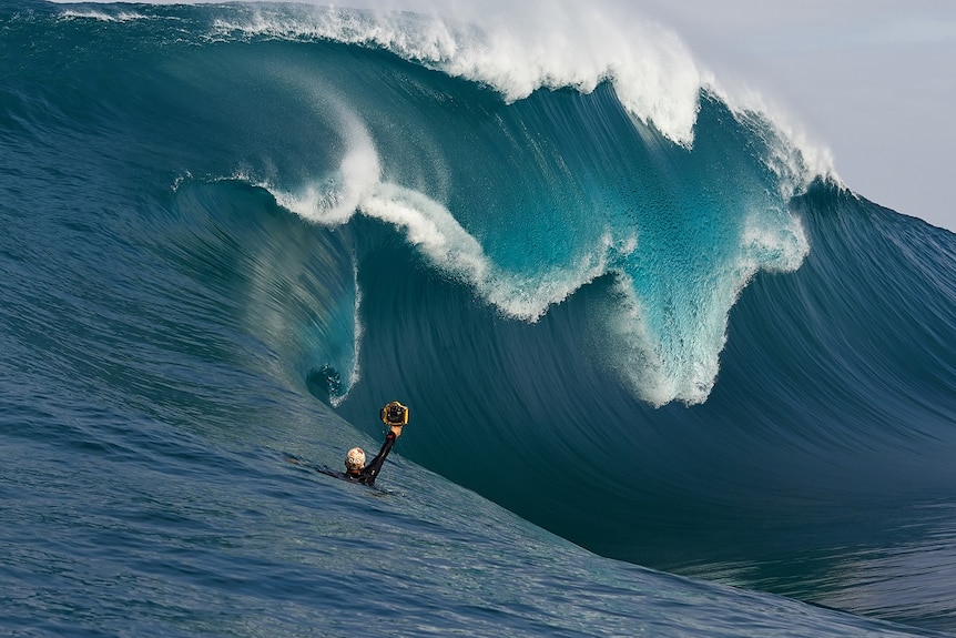 Russell Ord focusing in on a big wave