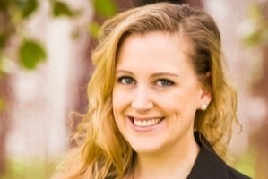 A headshot of Madeline Gleeson outdoors with her smiling 