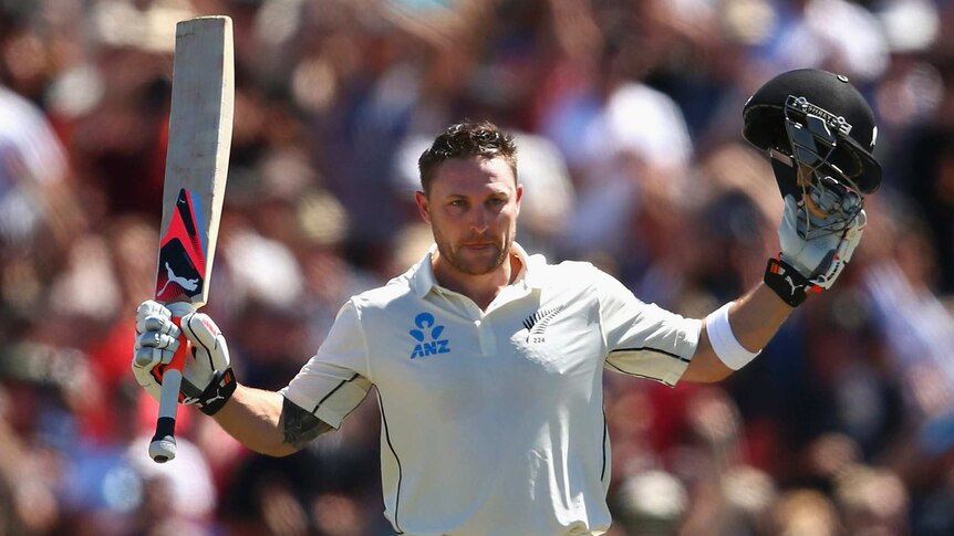 History maker ... Brendon McCullum celebrates after breaking the world record for the fastest Test century