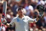 History maker ... Brendon McCullum celebrates after breaking the world record for the fastest Test century