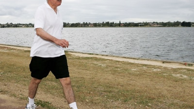 File photo: Former PM John Howard takes an early morning in Perth (Getty Images: Paul Kane)