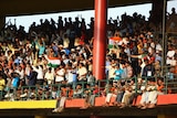 Cricket mad: The explosions didn't stop fans swarming to the Chinnaswamy stadium.