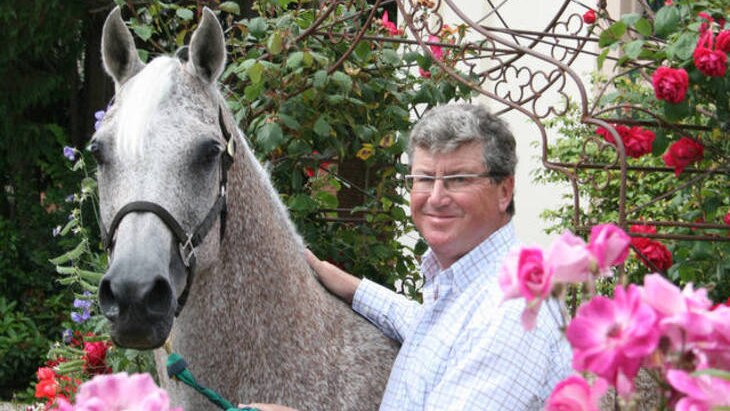 Casino boss Greg Farrell with Arabian horse.