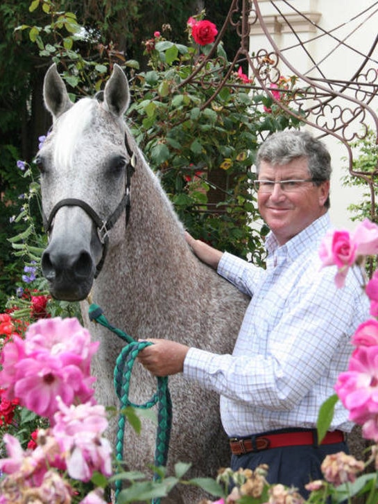 Casino boss Greg Farrell with Arabian horse.