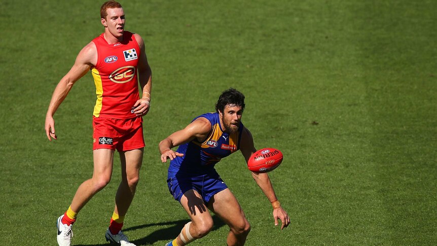 Josh Kennedy of West Coast and Rory Thompson of Gold Coast compete for the ball at Carrara.