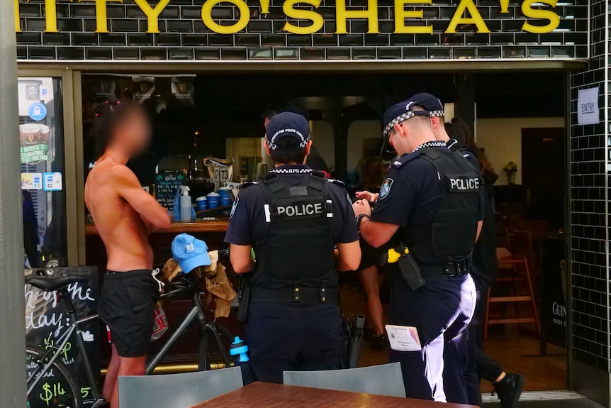 police with shirtless man