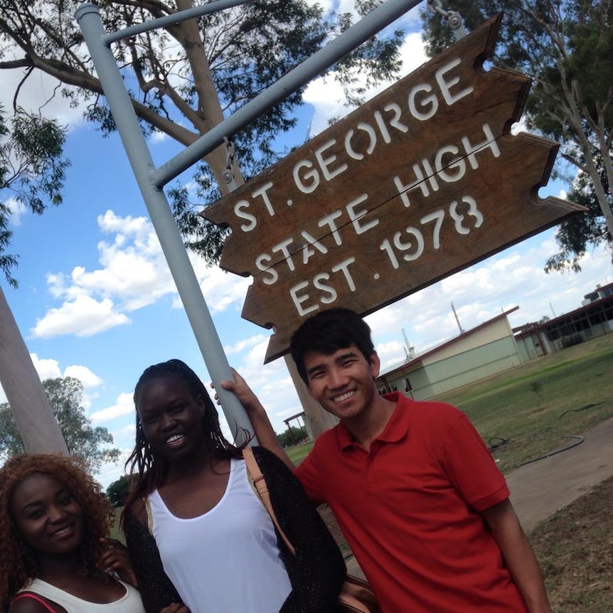 Members of e-raced stand outside St George High School